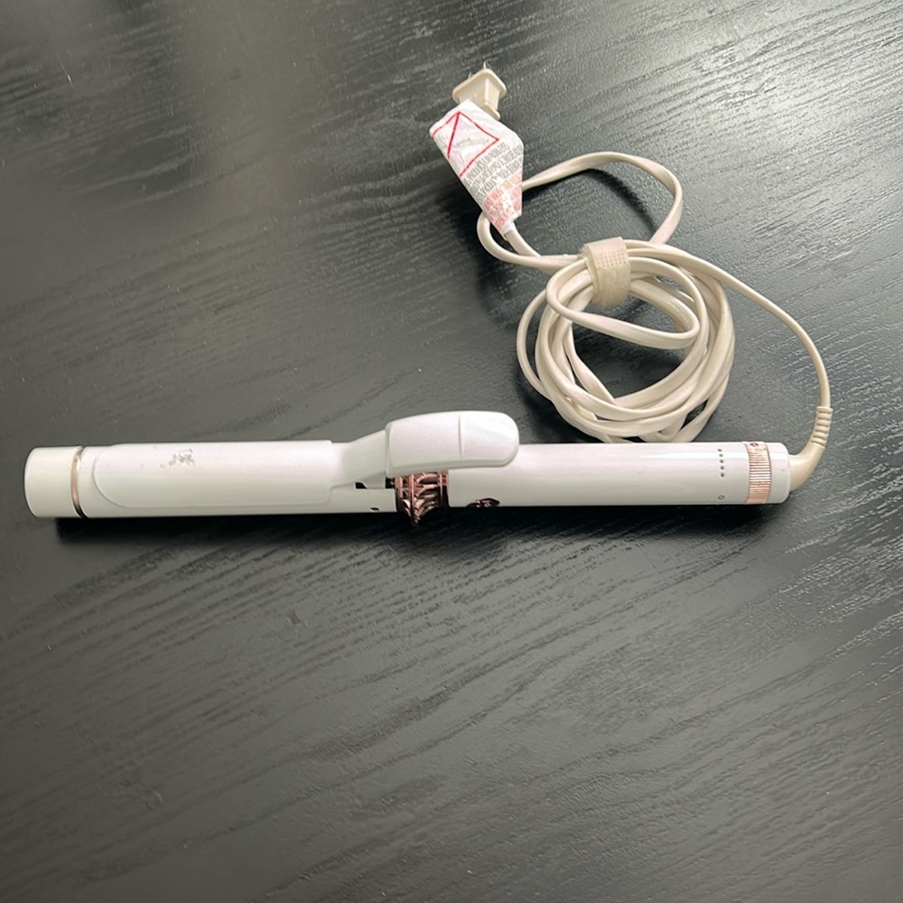 T3 1.25 inch curling iron.  Some wear but in great working condition